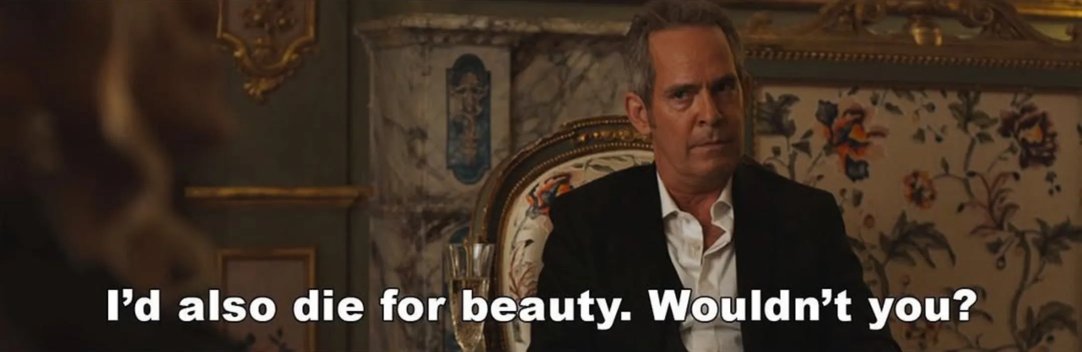 Scene from The White Lotus. Quentin says "I'd also die for beauty. Wouldn't you?"